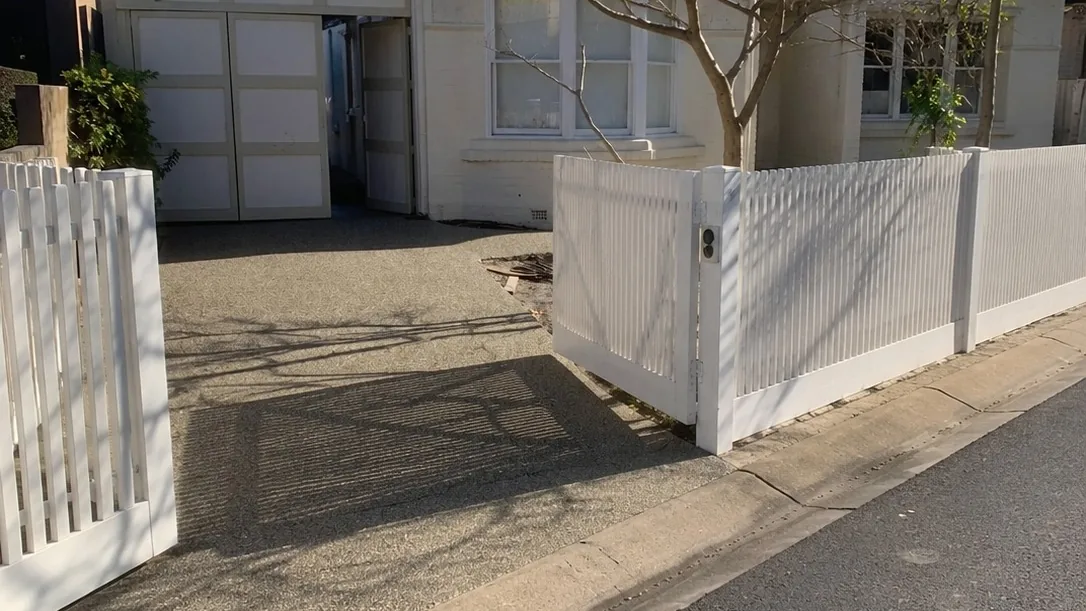 Repaired concrete driveway and crossover at a white weatherboard Melbourne home